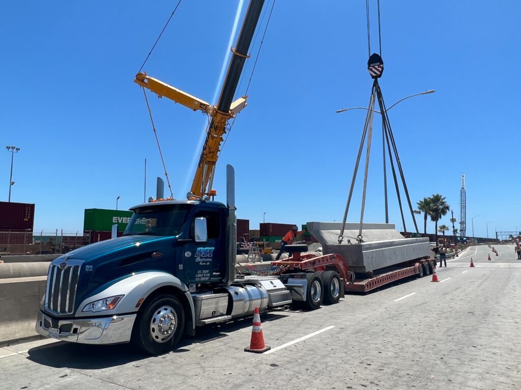 Crane loading the flatbed truck